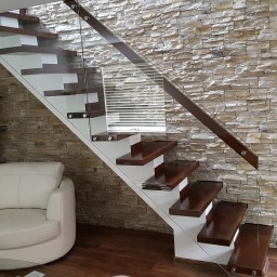 Wooden stairs with glass balustrade